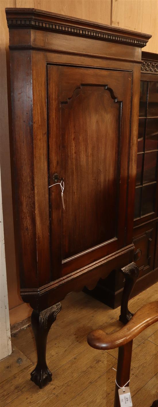 A George III mahogany corner cupboard, on later stand W.89cm